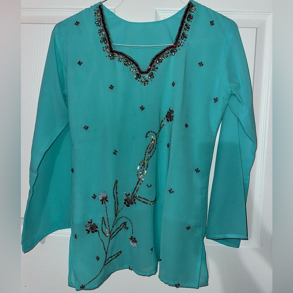 Turquoise green shirt very beautiful to go out on a dinner date